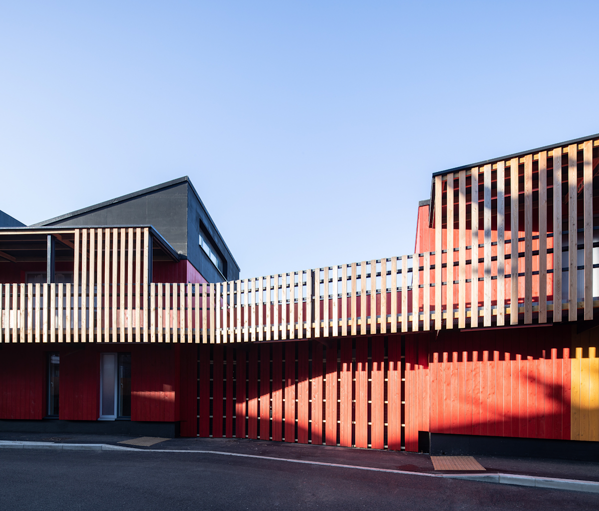 Modern building with vertical wooden slats on Abbott Road 384 in London.