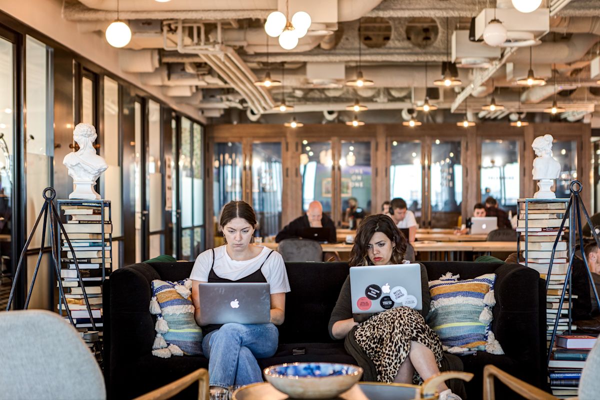 A modern coworking space with people working on laptops at Appold Street 9, London.