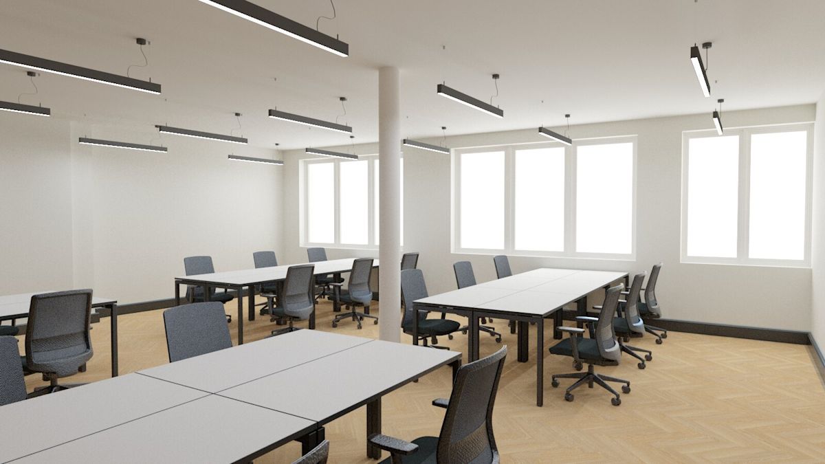 A modern office space in London with desks and swivel chairs arranged in rows.