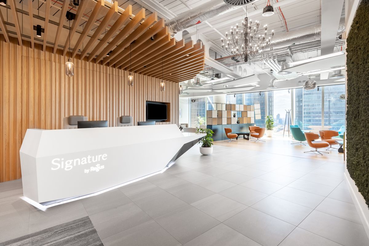 Modern reception area in a bright office space at 100 Bishopsgate, London with contemporary furniture and sleek design.