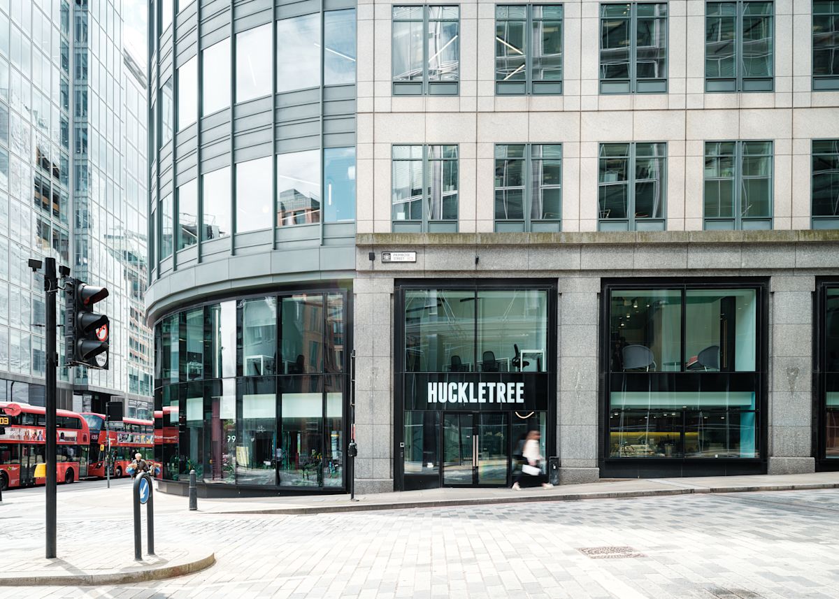 The modern facade of 199 Bishopsgate, featuring HuckleTree's entrance and large glass windows.
