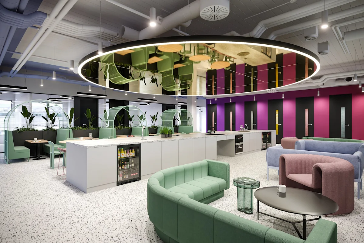 Modern office lounge area with colorful seating and a central communal kitchen at Bishopsgate 199 London.