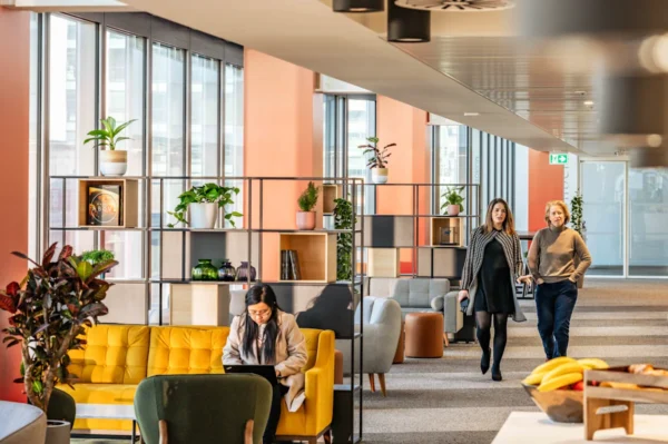 A bright, modern office space at Bishopsgate 22 in London with people working and walking.