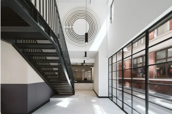 Modern office interior at Bishopsgate 222 B in London featuring a sleek staircase and glass wall.