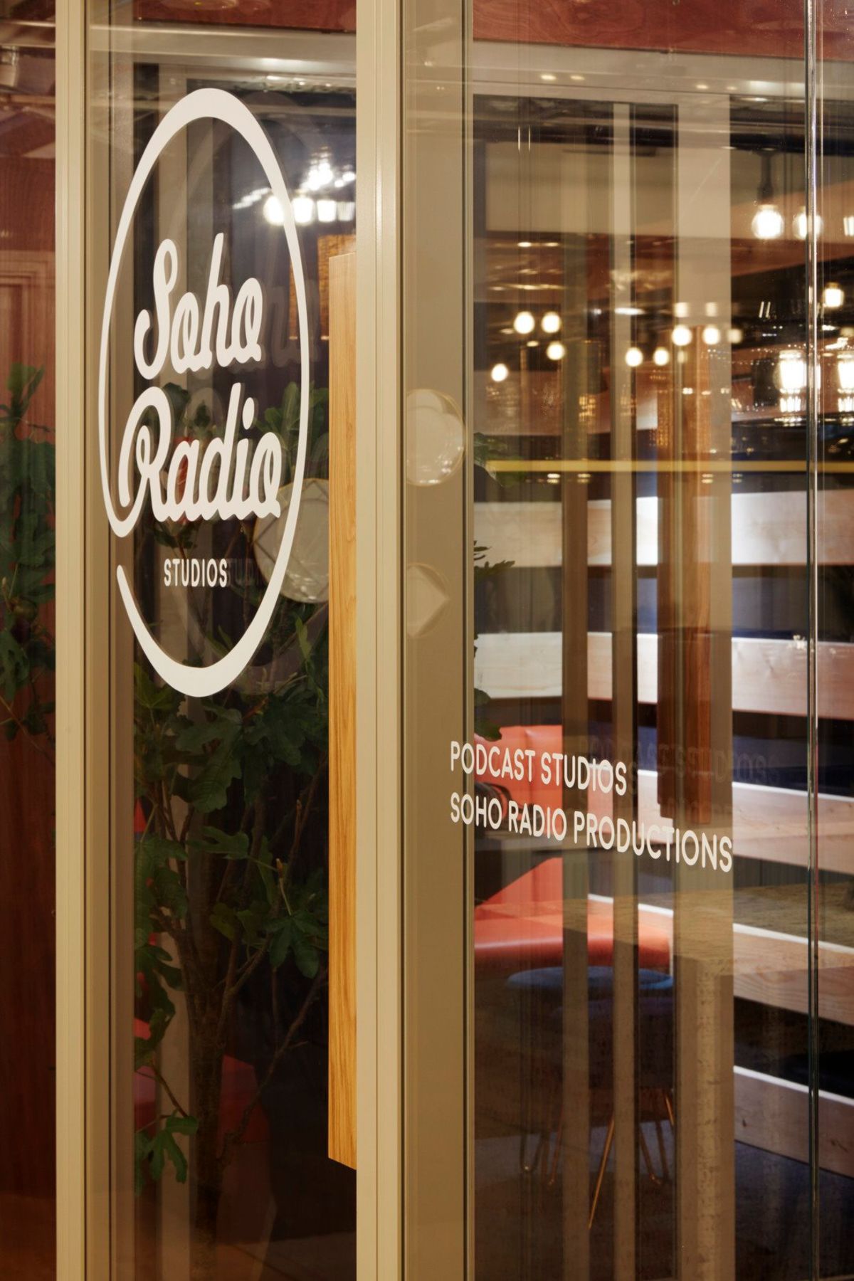 Entrance of Soho Radio Studios at 33 Broadwick Street, London, with visible signage for podcast studios and productions.