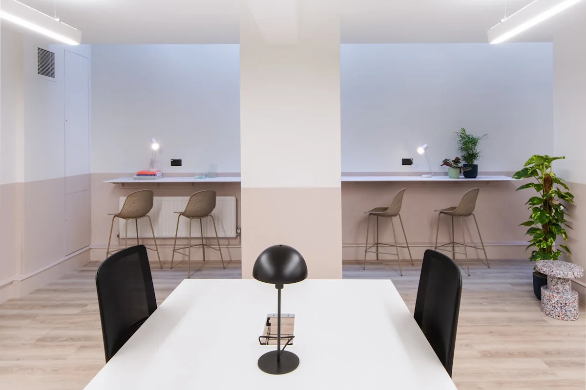 A modern office space with minimalist desk areas and seating at Broadwick Street 45, London.