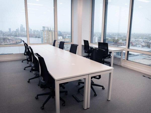 Modern office space with large windows offering a view of London from Cabot Square 25.