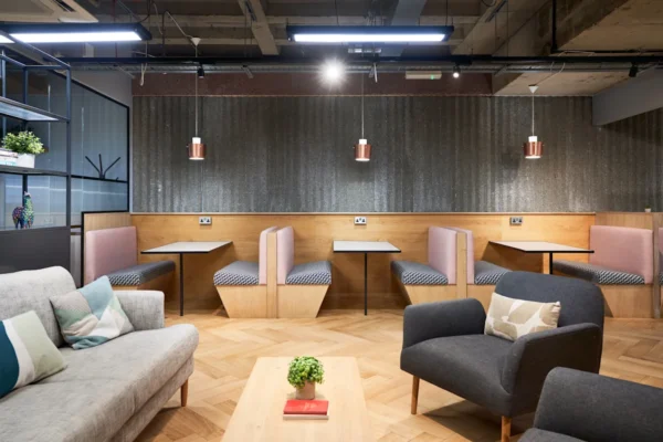 Modern lounge area with stylish booths and comfortable seating at Crown Place 4, London.