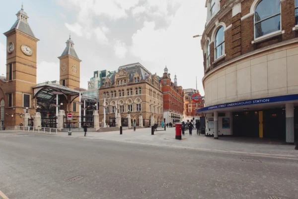 View of Liverpool Street Underground Station with surrounding historic buildings in London.