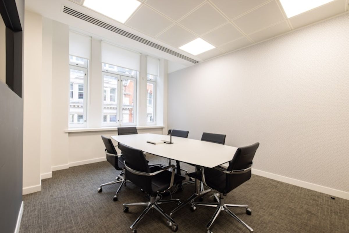 A modern conference room with a rectangular table and six chairs at 42 New Broad Street, London.