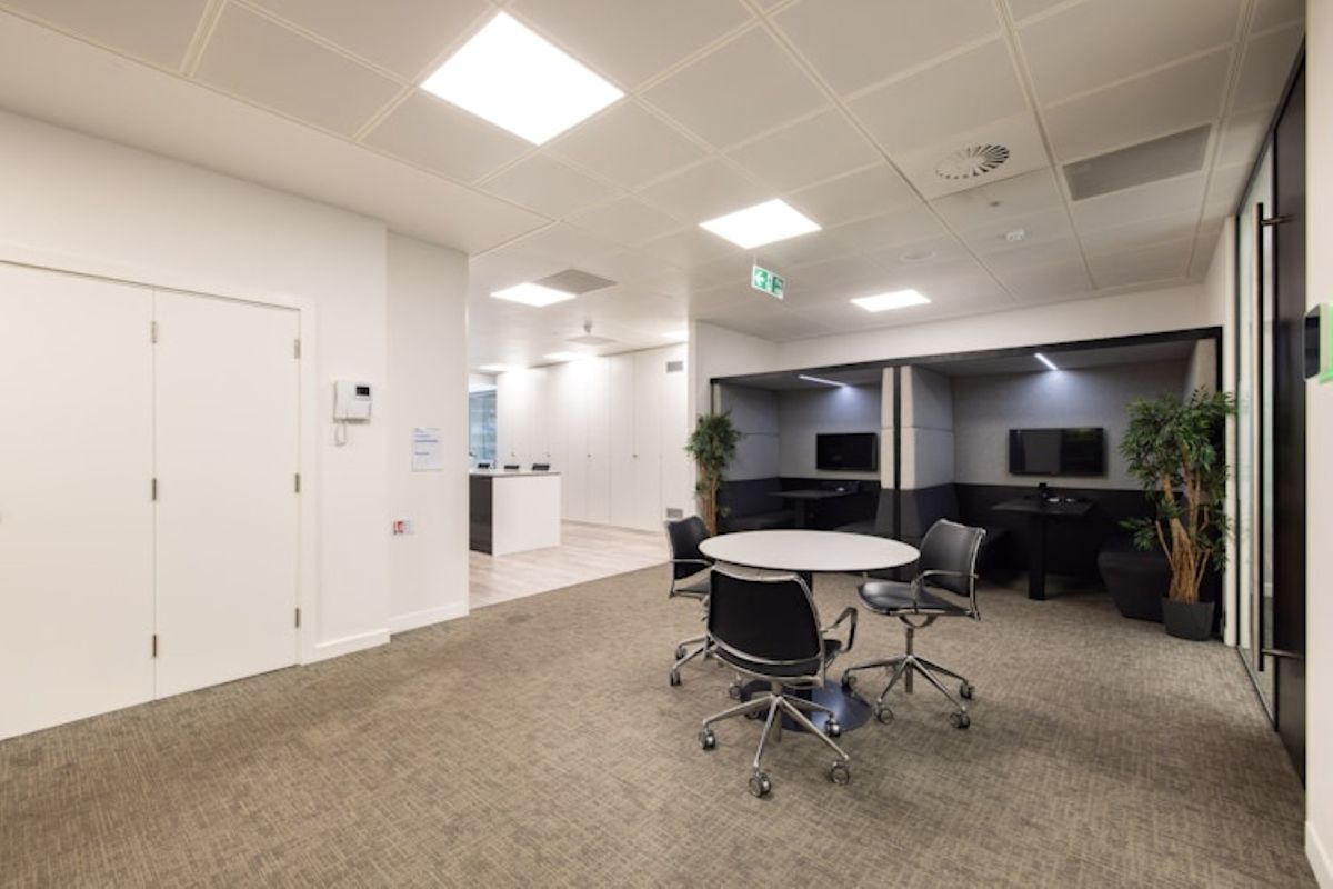 Modern office space interior with a round table and chairs at New Broad Street 42, London.