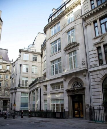 Facade of 46 New Broad Street in London, featuring elegant architecture and large windows.