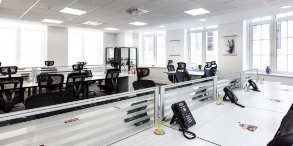Modern open-plan office with rows of desks and chairs at 46 New Broad Street, London.