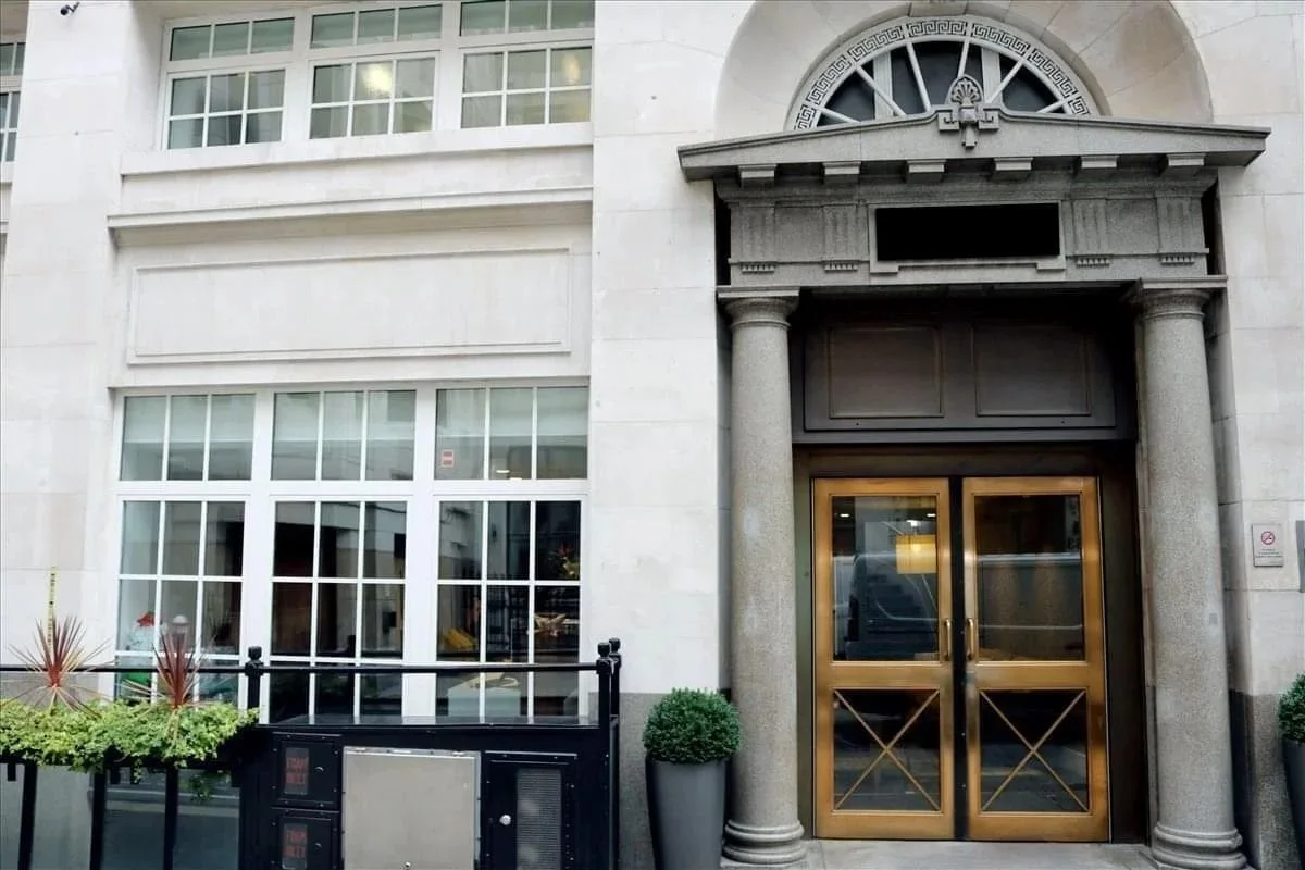 Facade of 46 New Broad Street in London with an ornate entrance and large windows.