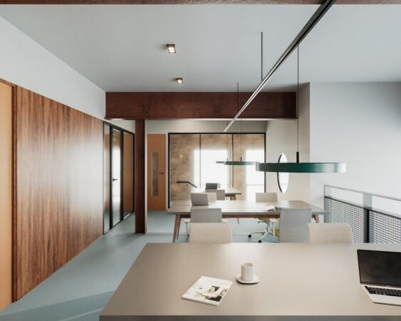 A modern office space with wooden walls, sleek furniture, and overhead lighting at New Inn Yard in London.