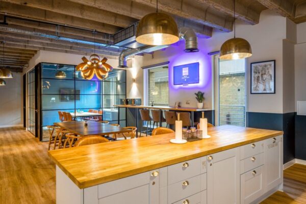 Modern office space with wooden furniture and stylish lighting at New Street 14, London.