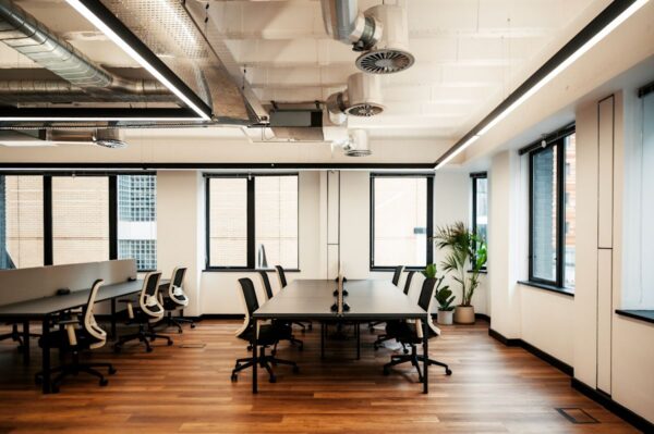 Modern office space in Norton Folgate, London with wooden floors and plants.
