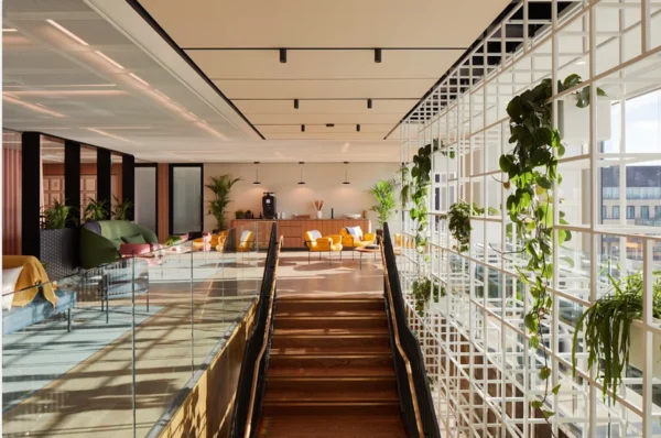Modern office interior with natural light, plants, and stylish seating on Old Broad Street 69, London.