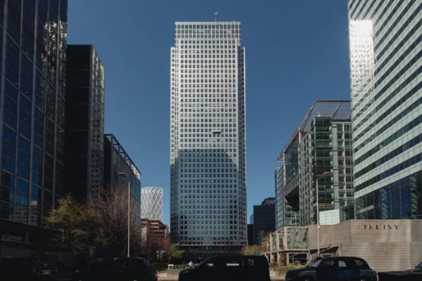 A view of One Canada Square in London's Canary Wharf, surrounded by other skyscrapers.