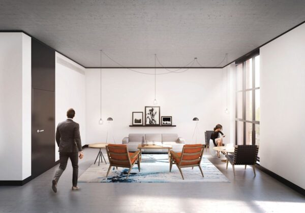 A modern office lounge on Phipp Street, London, with minimalistic furniture and large windows.