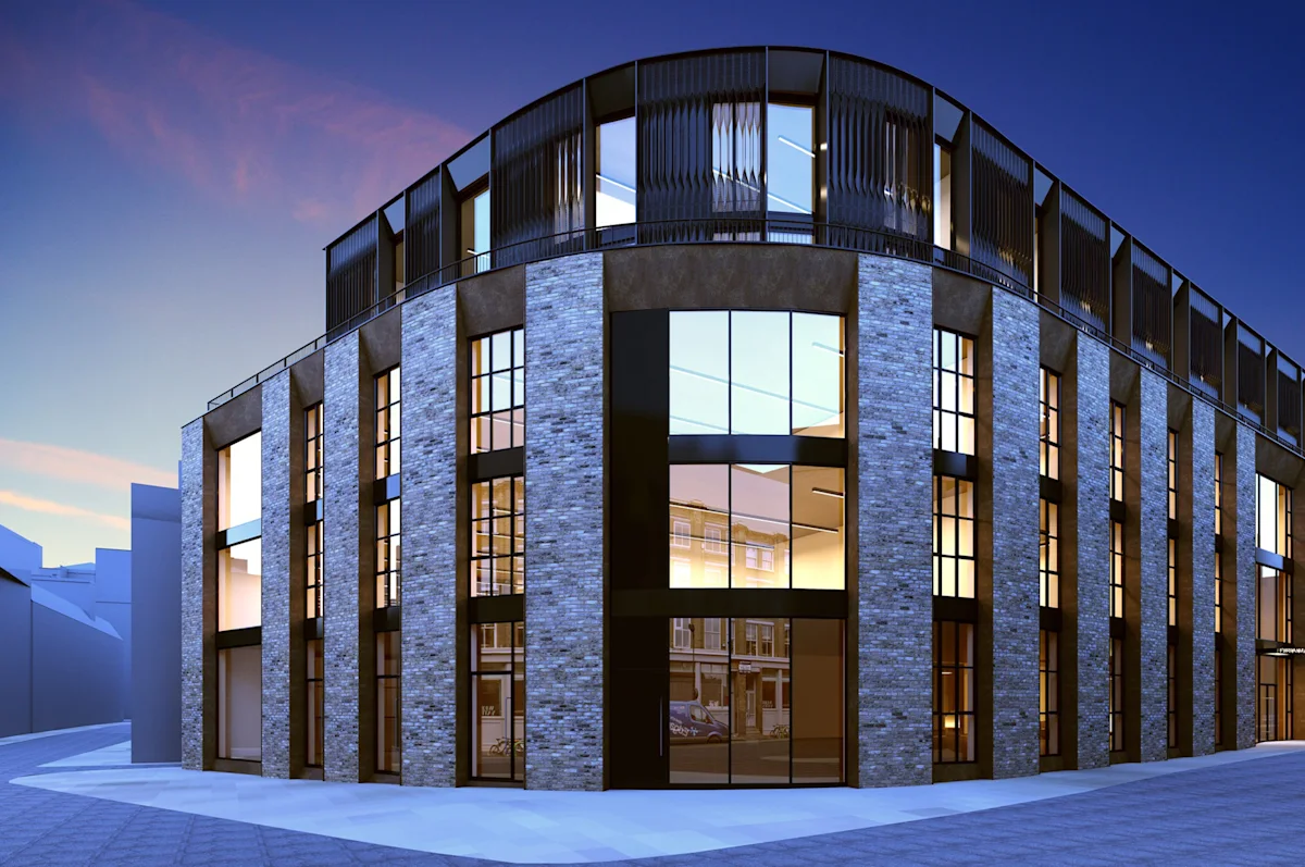 Modern building on Phipp Street in London at dusk with large windows and brick exterior.