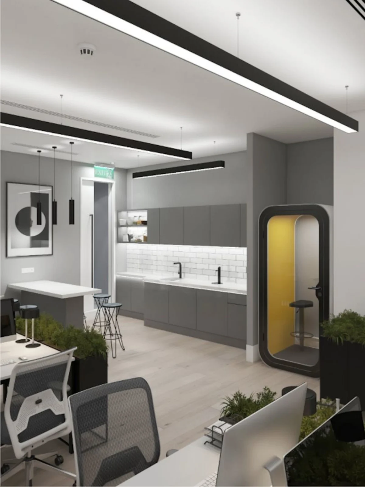 Modern office space with desks, a kitchenette, and a small phone booth on Poland Street, London.