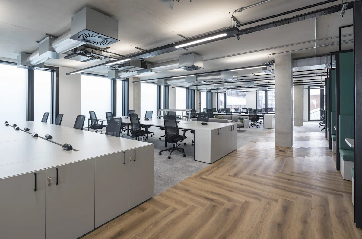 Modern office space at Shoreditch High Street 168, London, featuring open workstations and large windows.
